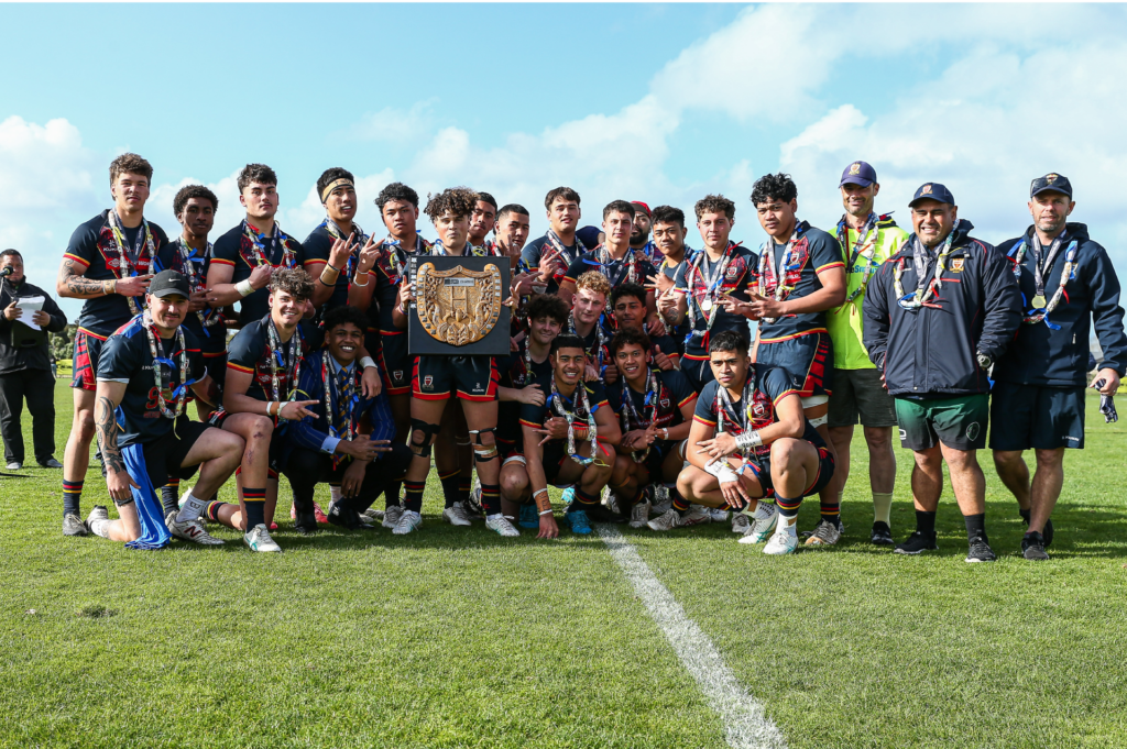 St Thomas rugby league team holding trophy